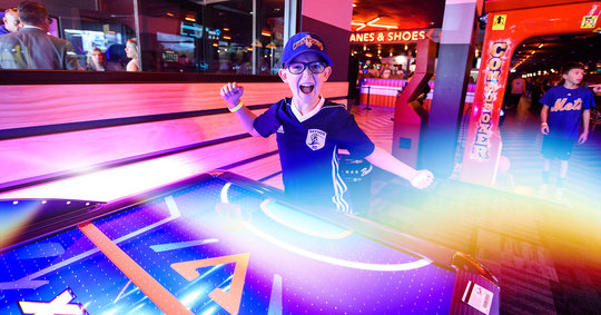 Boy having fun in an arcade